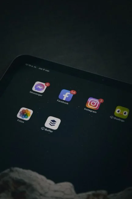A modern tablet and smartphone showing web content on a reflective surface, emphasizing technology and connectivity.